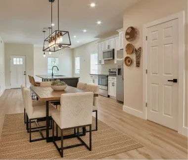 Bright open-plan dining room and kitchen in a newly built custom home